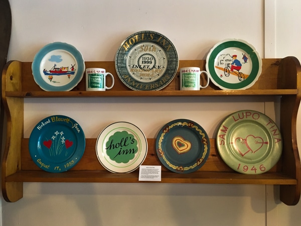 Commemorative plates from Holl's Inn on display at the Inlet Historical Society