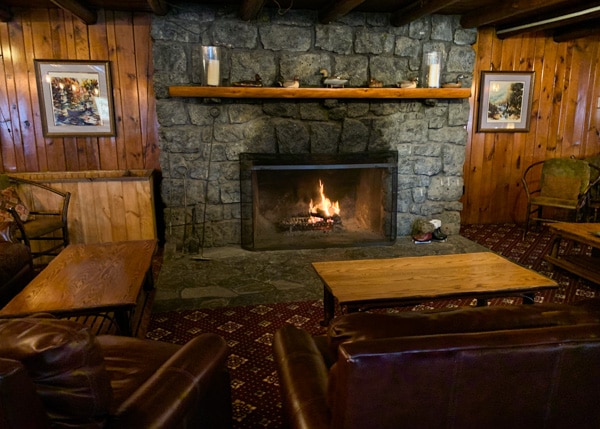 Large stone fireplace in the Garnet Hill Lodge lobby. 