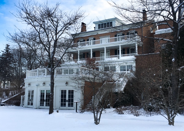 Exterior view of Aurora Inn on a snowy day.