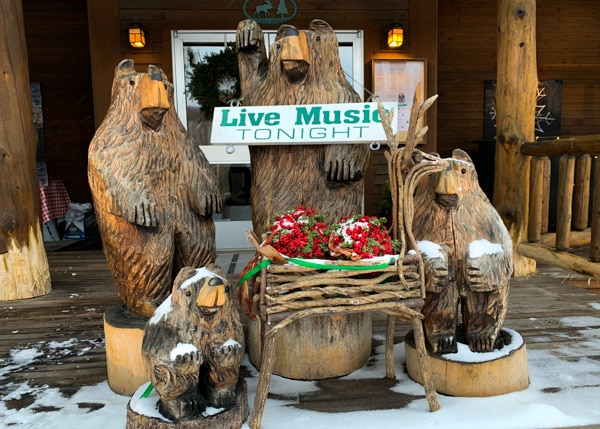 Family of bears carved out of logs in front of a restaurant in the Adirondacks.
