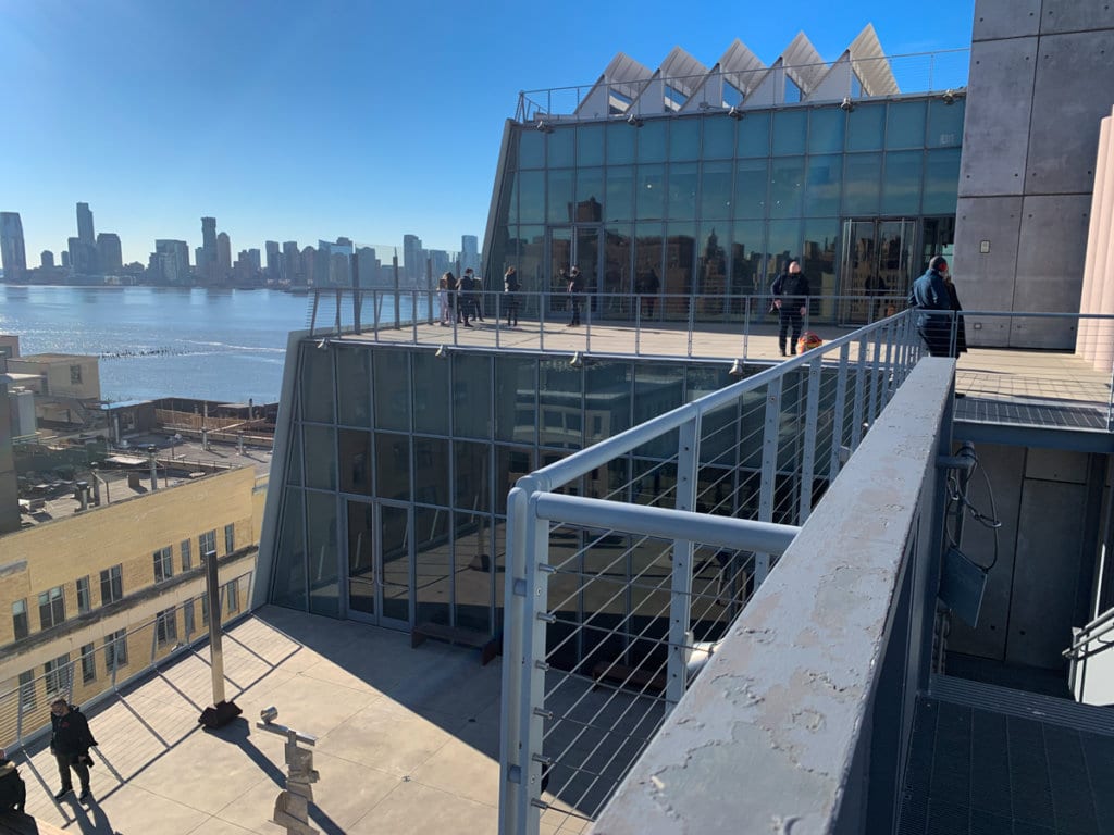 Exterior of Whitney Museum, looking up at second floor terrace. 
