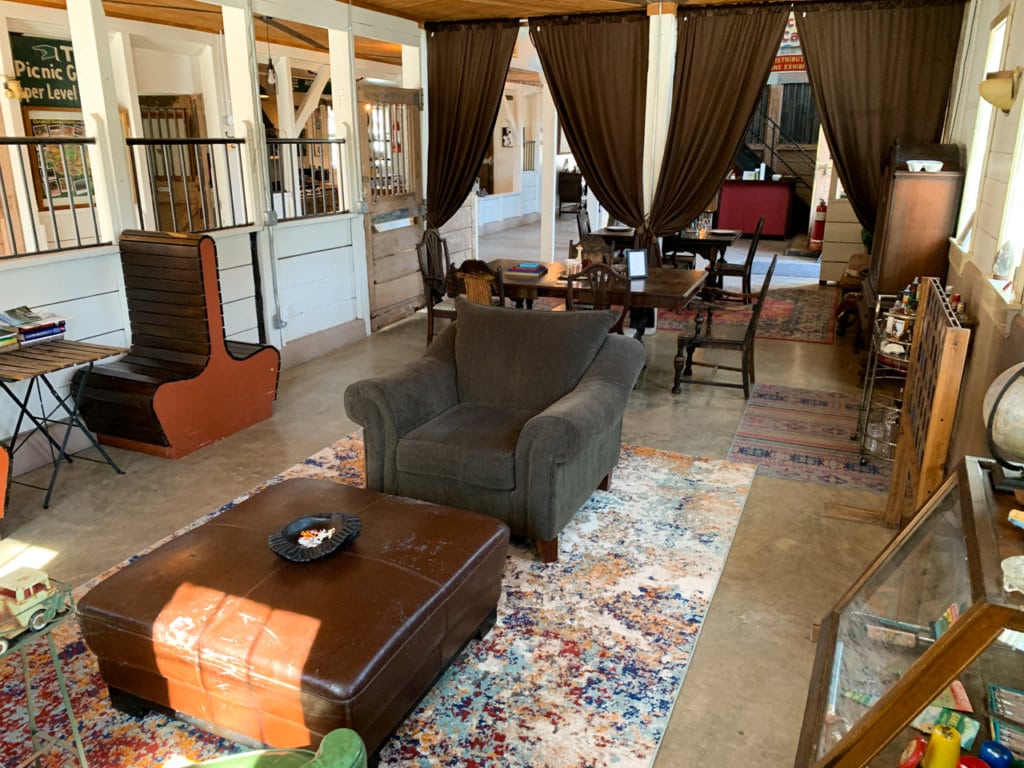 Tables and chairs in the common area of the inn.