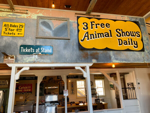 Long Neck Inn kitchen with several old signs hanging on the walls above it.