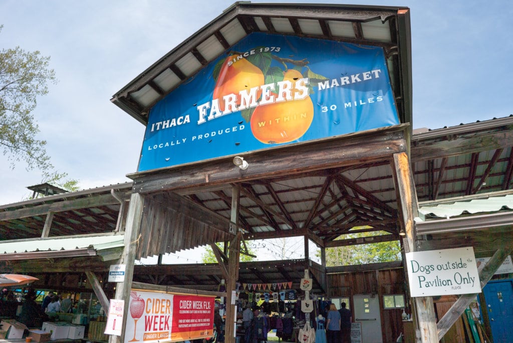 Entrance to a pavilion with a sign indicating it is the Ithaca Farmer's Market. 