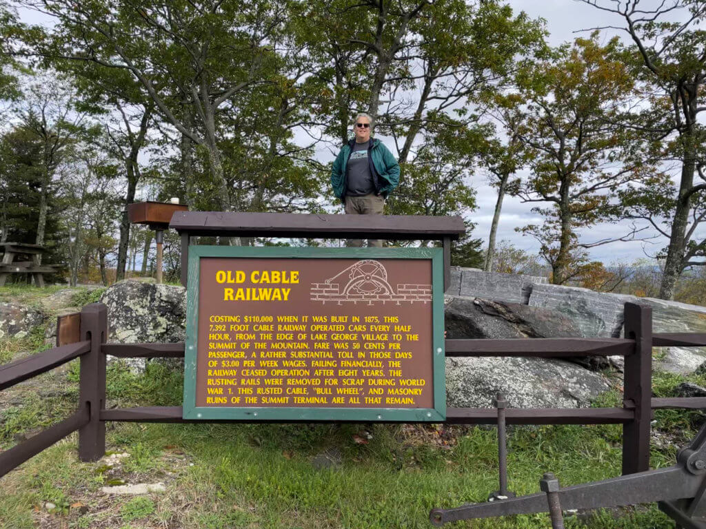 Informational sign explaining history of Old Cable Railway at the summit of Prospect Mountain.
