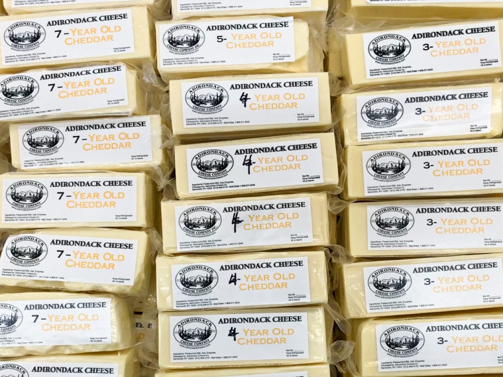 Three rows of packages of Adirondack Cheese from a cheese store in Barneveld, NY. 