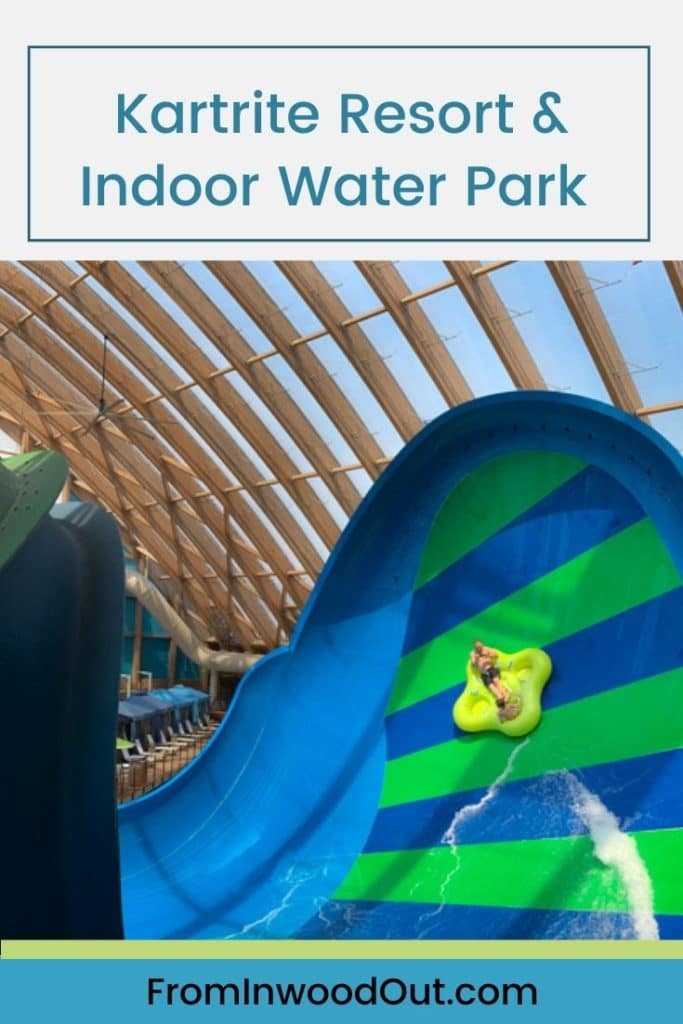 A large waterslide at an indoor water park. Text overlay says Kartrite Resort & Indoor Water Park. 