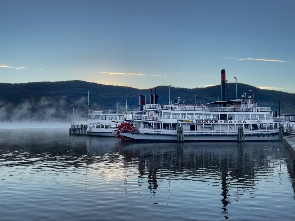 Steamboat named Minne-Ha-Ha parked at dock at sunrise. 
