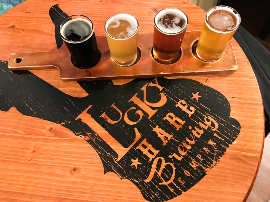 A flight of beer sitting on a table at Lucky Hare Brewing Company in Watkins Glen, NY.