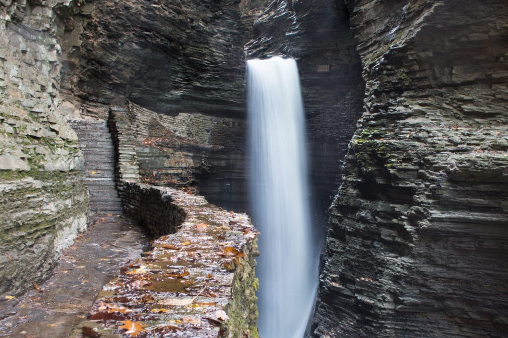 A single waterfall gushing down off the Gorge Trail at Watkins Glen State Park.