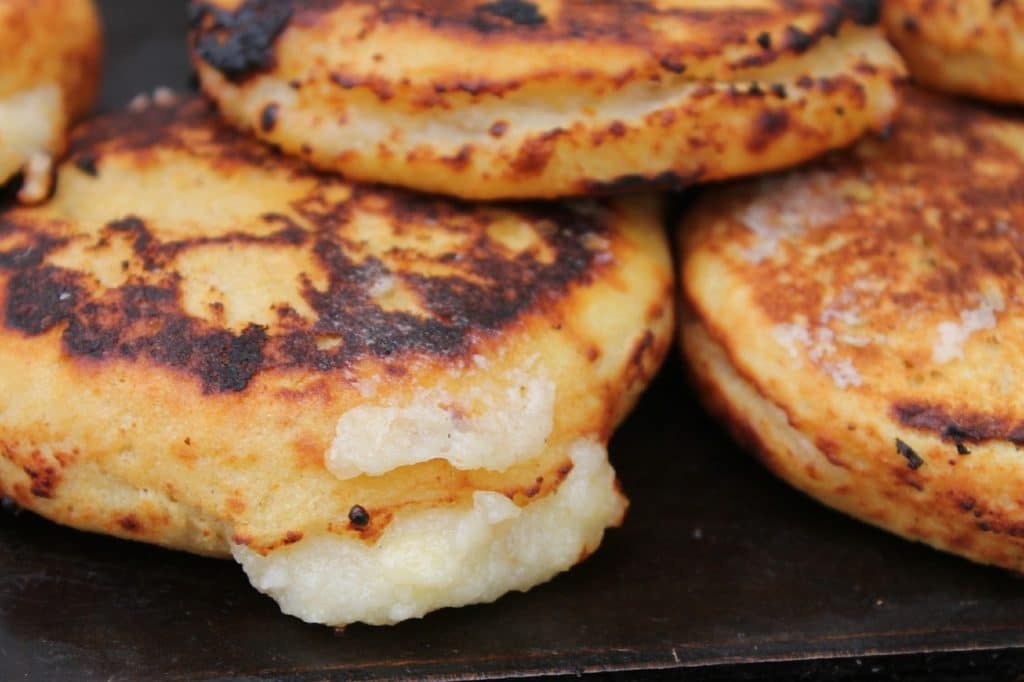 Close-up of a pile of freshly-made arepas.