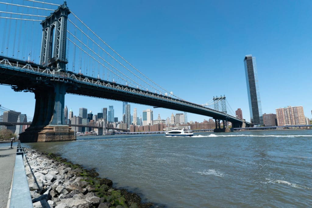 NYC Ferry crossing under the Manhattan Bridge. 
