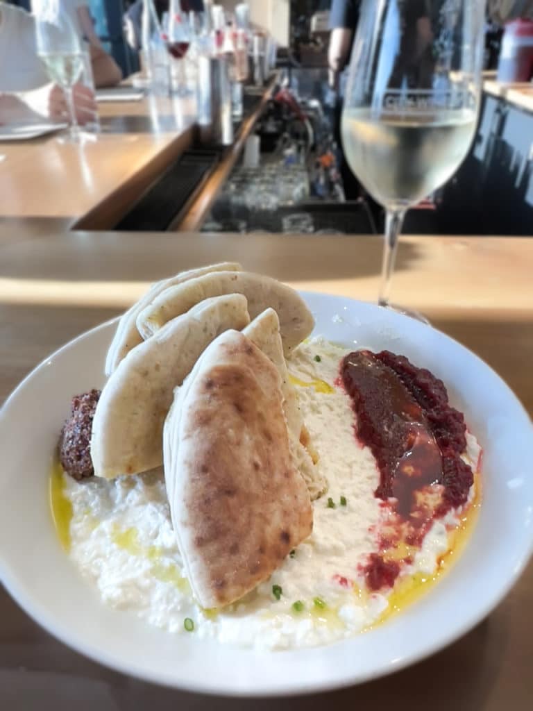Whipped feta topped with several pieces of pita bread at City Winery in New York City.
