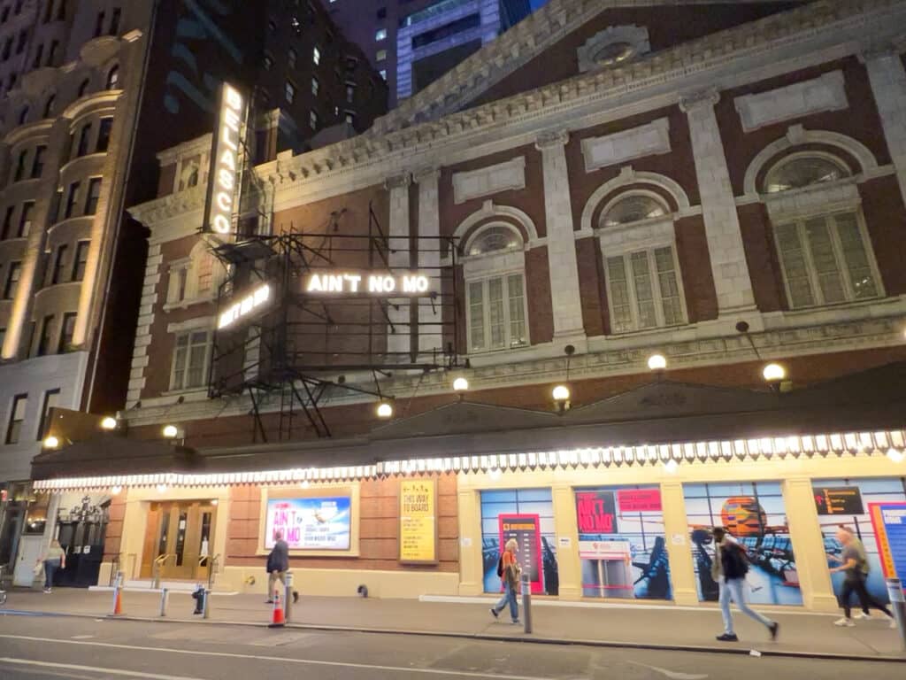 Exterior of the Belasco Theatre at night in New York City.