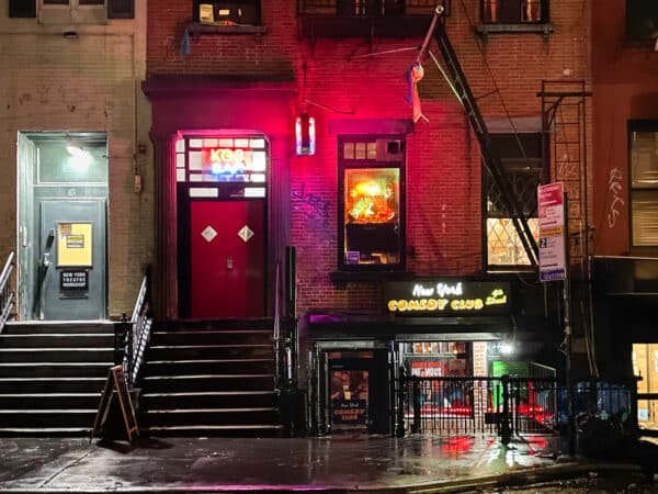 Exterior of KGB Bar at night in New York City.