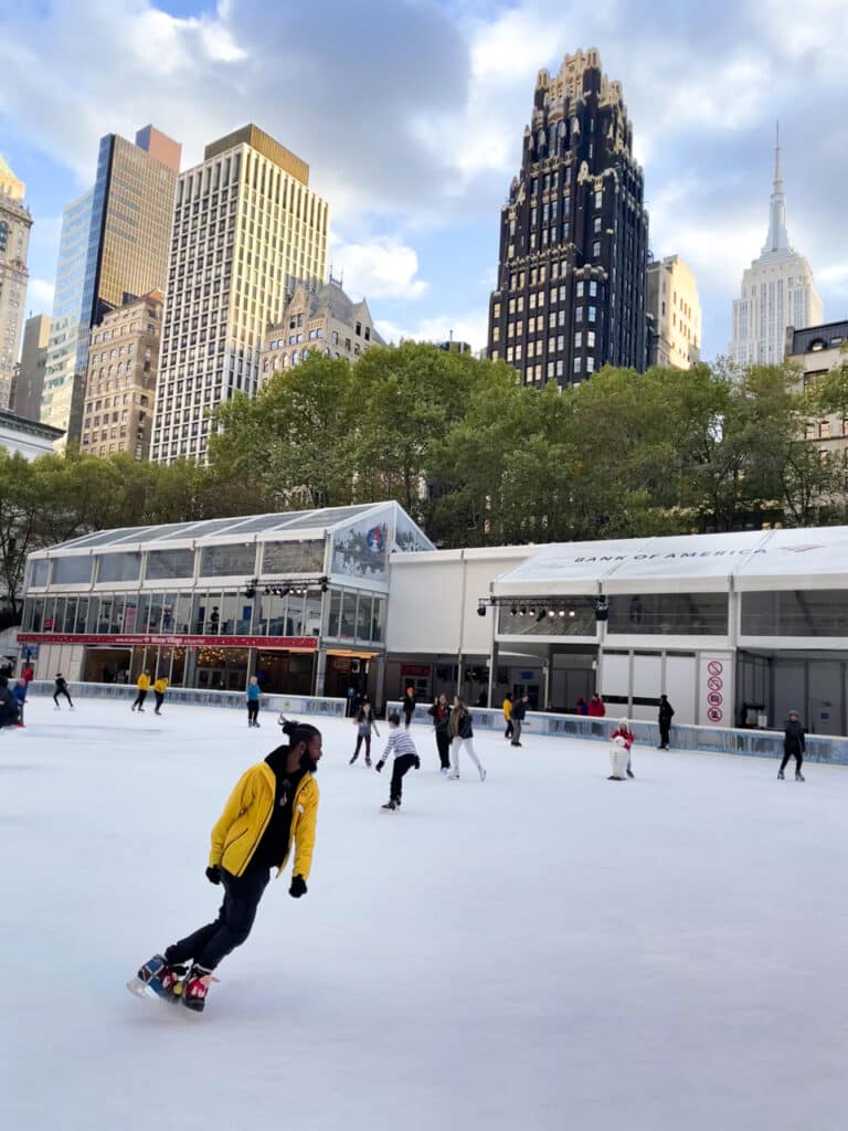 Ice skating at Bryant Park Winter Village in New York City.