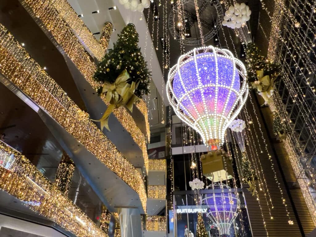 Millions of Christmas lights decorate the entrance of the Hudson Yards Shops in New York City. 