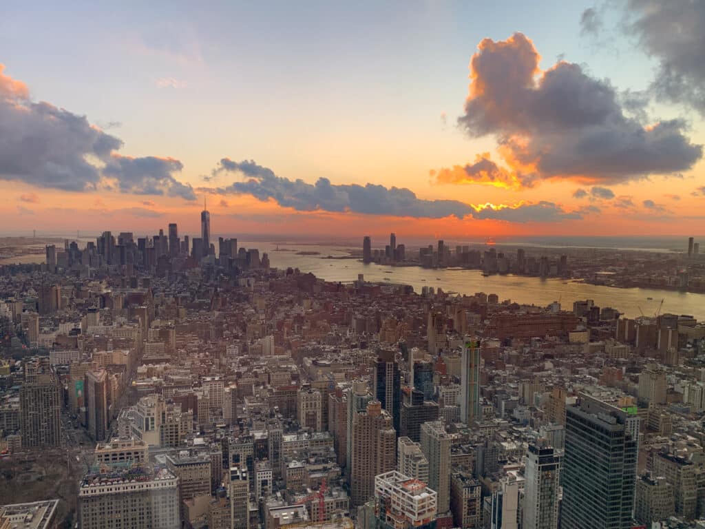 The Manhattan skyline at sunset, looking south toward One World Trade. The Hudson River is to the west. 