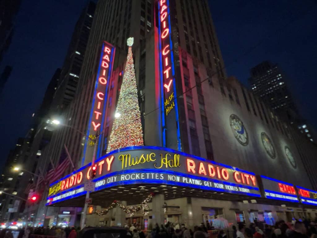 Outside Radio City Music Hall in New York City, decorated for Christmas.