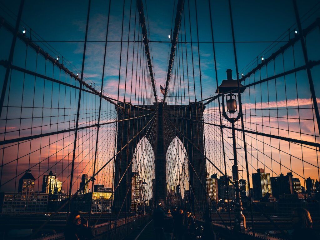 The Brooklyn Bridge in New York City at sunset. 