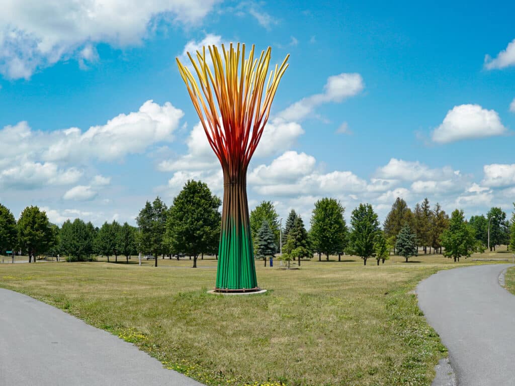A large, tree-shaped sculpture at an outdoor sculpture garden. 