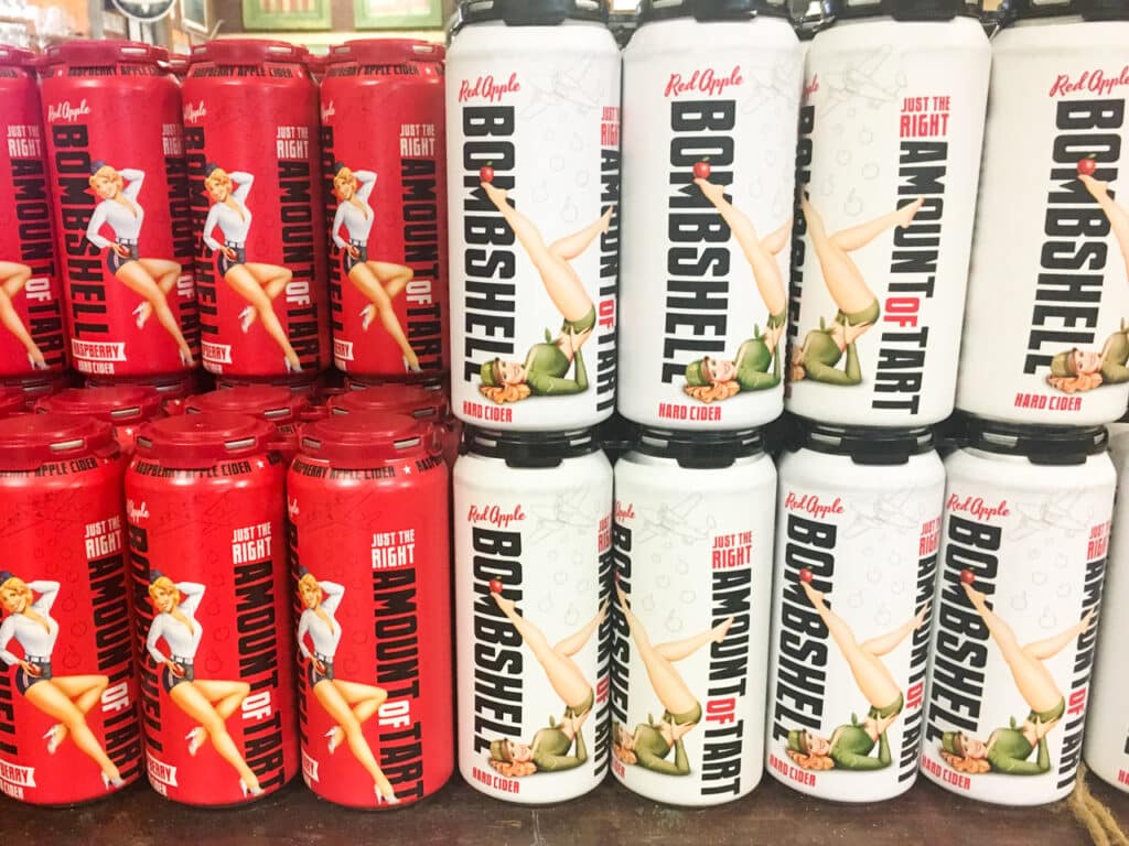 Stacks of a beer called Bombshell for sale in a brewery.