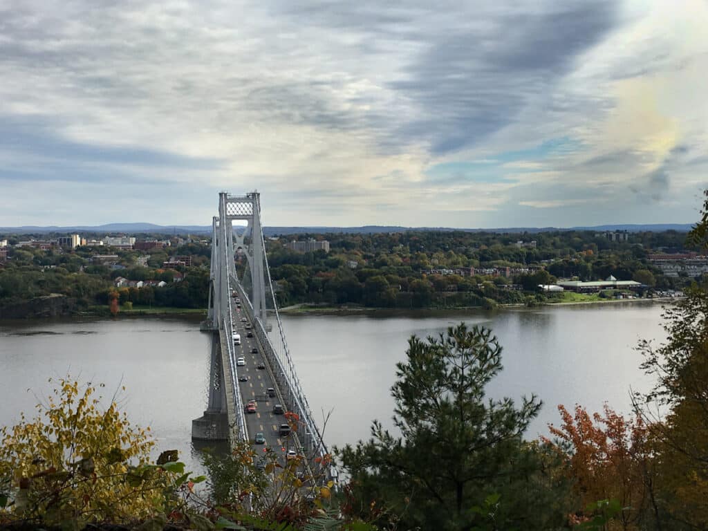 A bridge over the Hudson River seen from a distance.