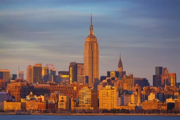 Empire State Building and Manhattan skyline at sunset.