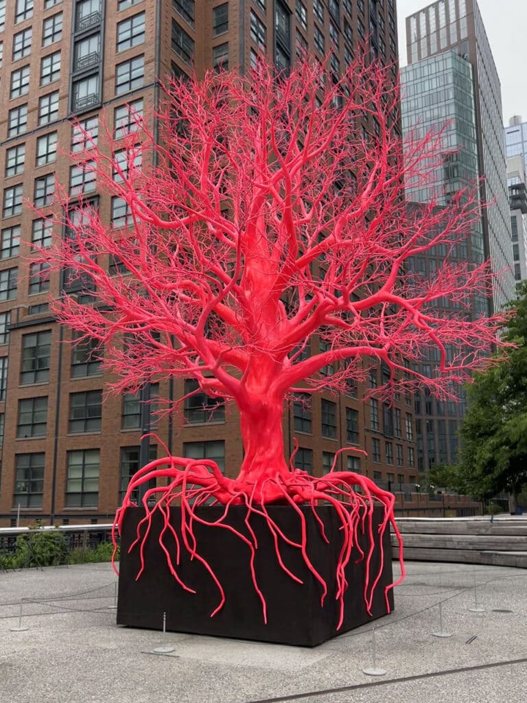 Large sculpture of a hot pink tree on the High Line in New York City.